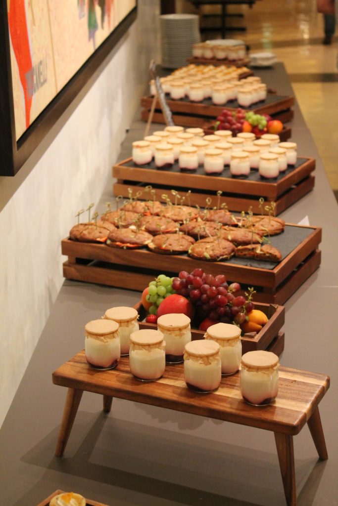 Sandwiches, fruit, and yogurt on display
