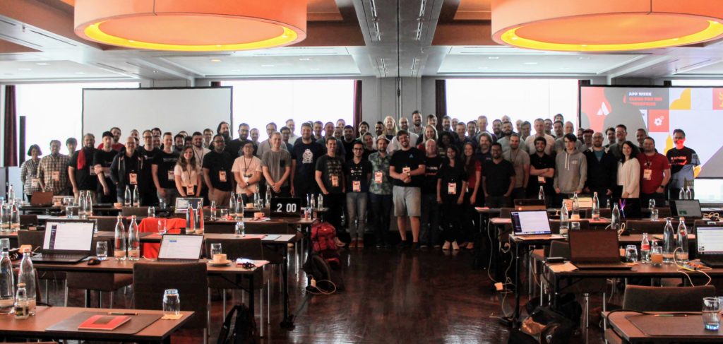 Group photo of all App Week participants standing at the front of the room